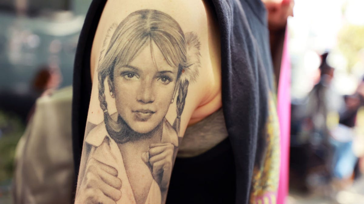 A protester with a Britney Spears tattoo attends a #FreeBritney rally in Los Angeles this past July.