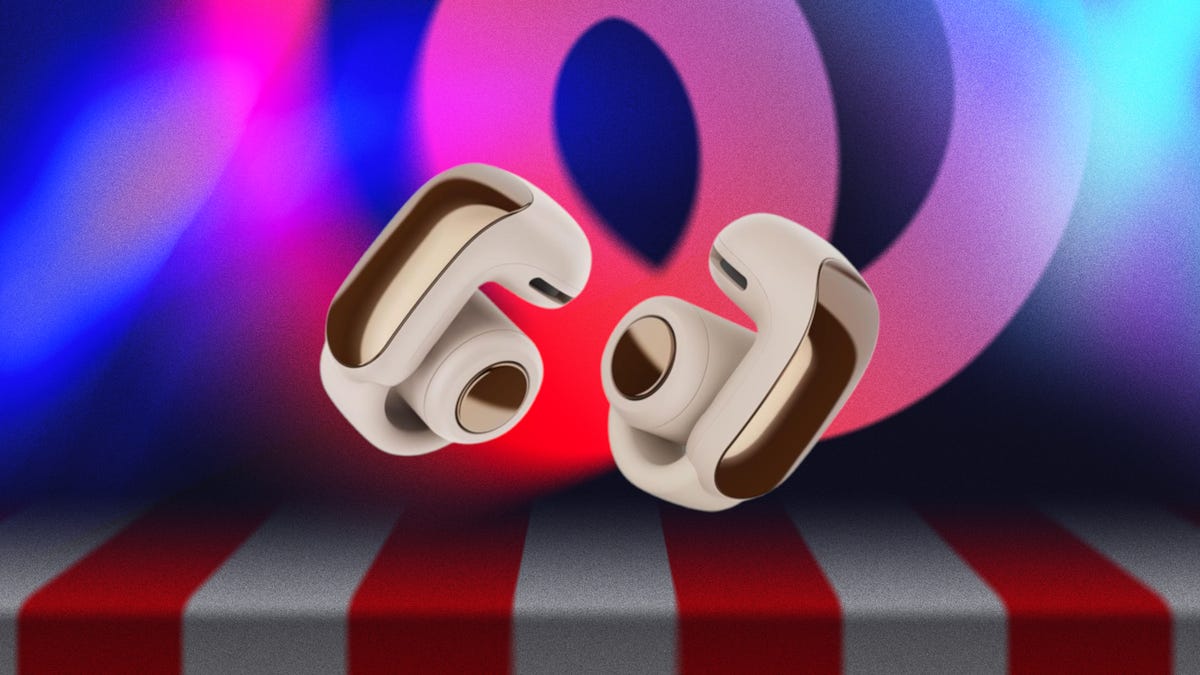 Bose Open Ultra earbuds in blue on a yellow background