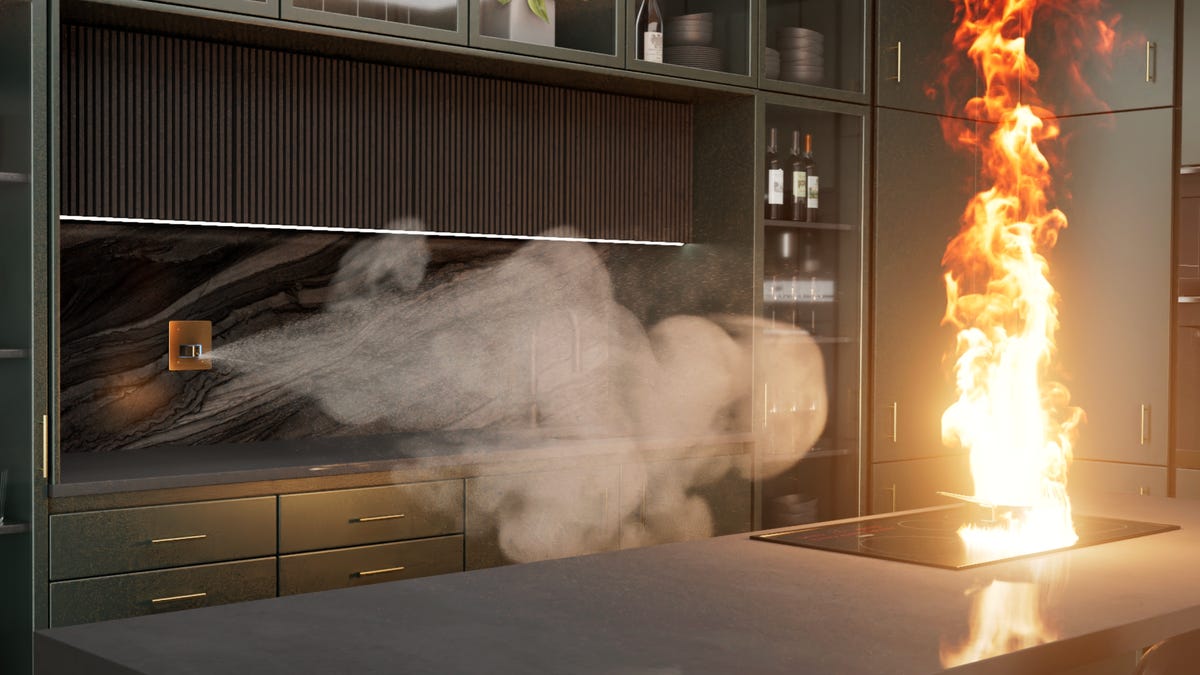 fire being shot with mist in kitchen