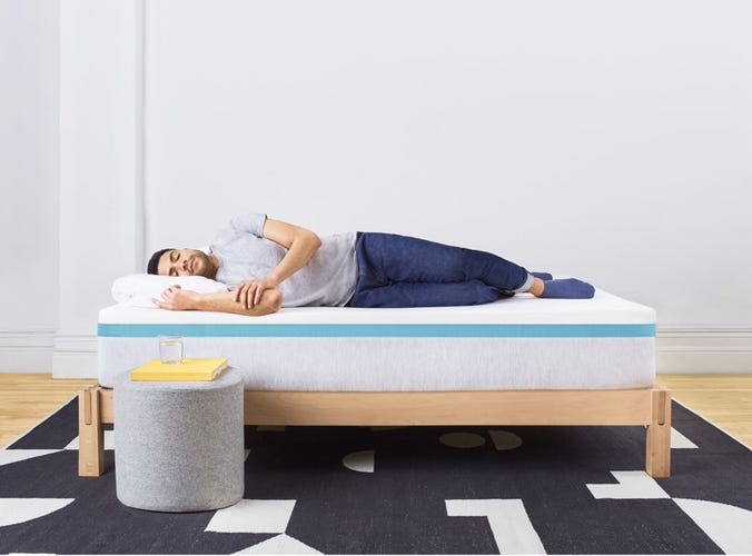 A man sleeping on the soft Sunset mattress from Helix