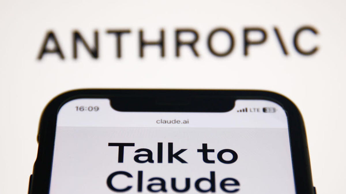 A mobile phone invites consumers to interact with Anthropic's chatbot, Claude.