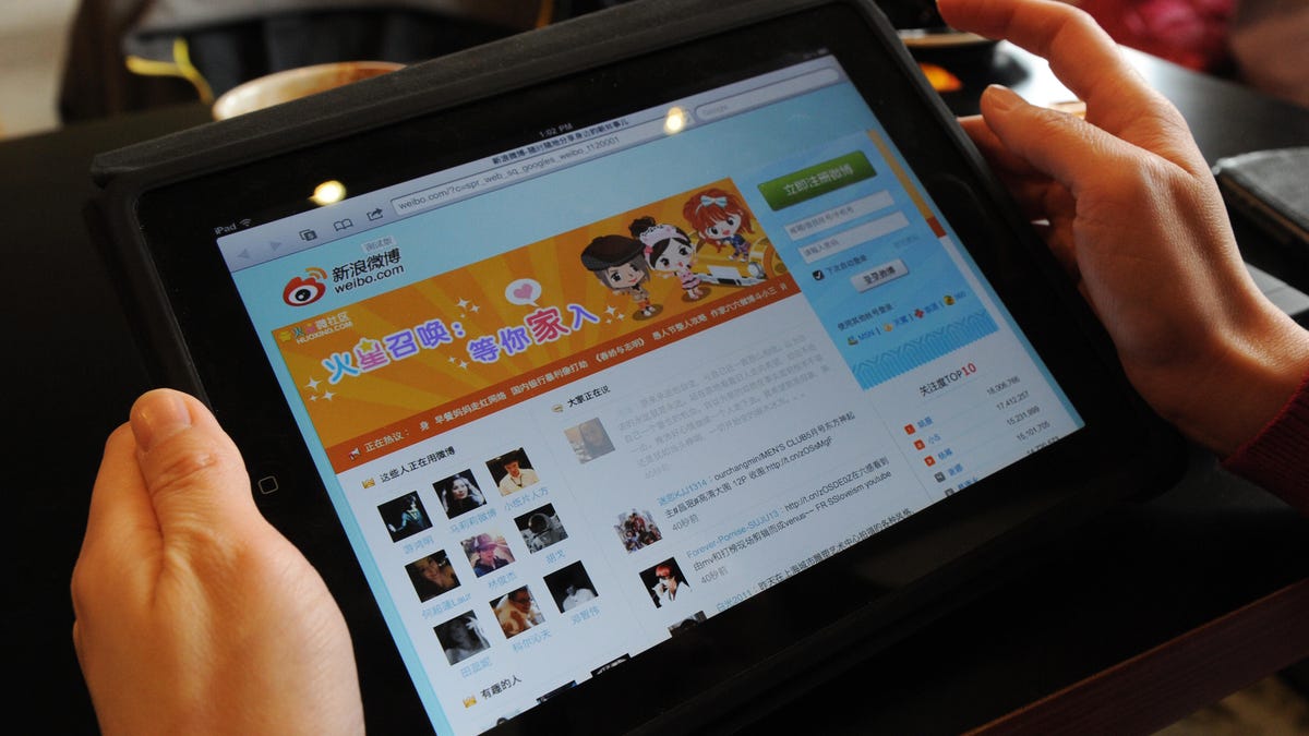 A woman views the Chinese social media w