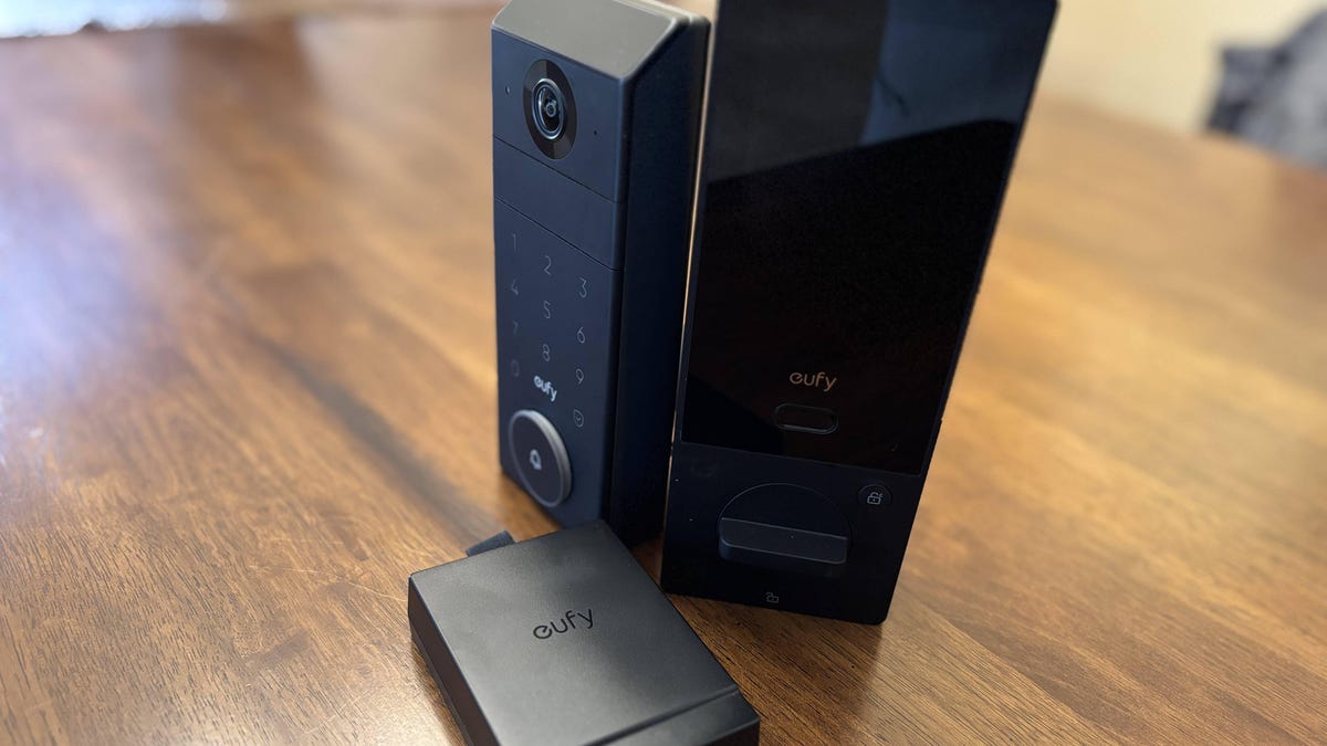 Eufy's new video smart lock pieces on a wood table.