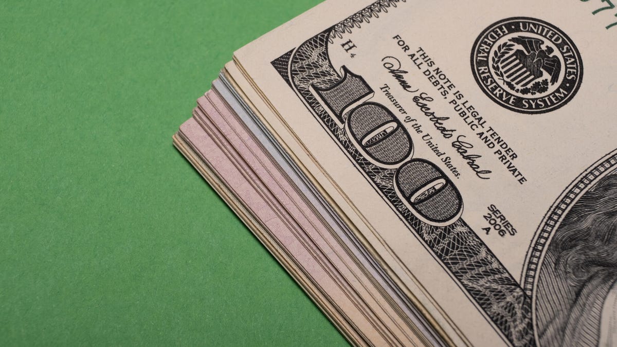 A fragment of the American dollar can be seen on the table