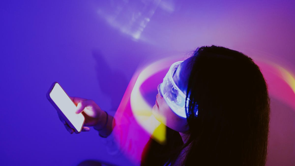 Woman in headset with phone