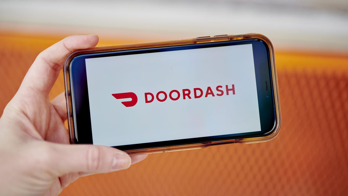 In this photo illustration the DoorDash logo is seen