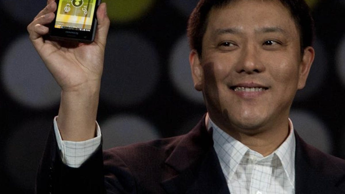 Liu Jun of Lenovo holding up the K800, Lenovo's first Intel-powered smartphone.