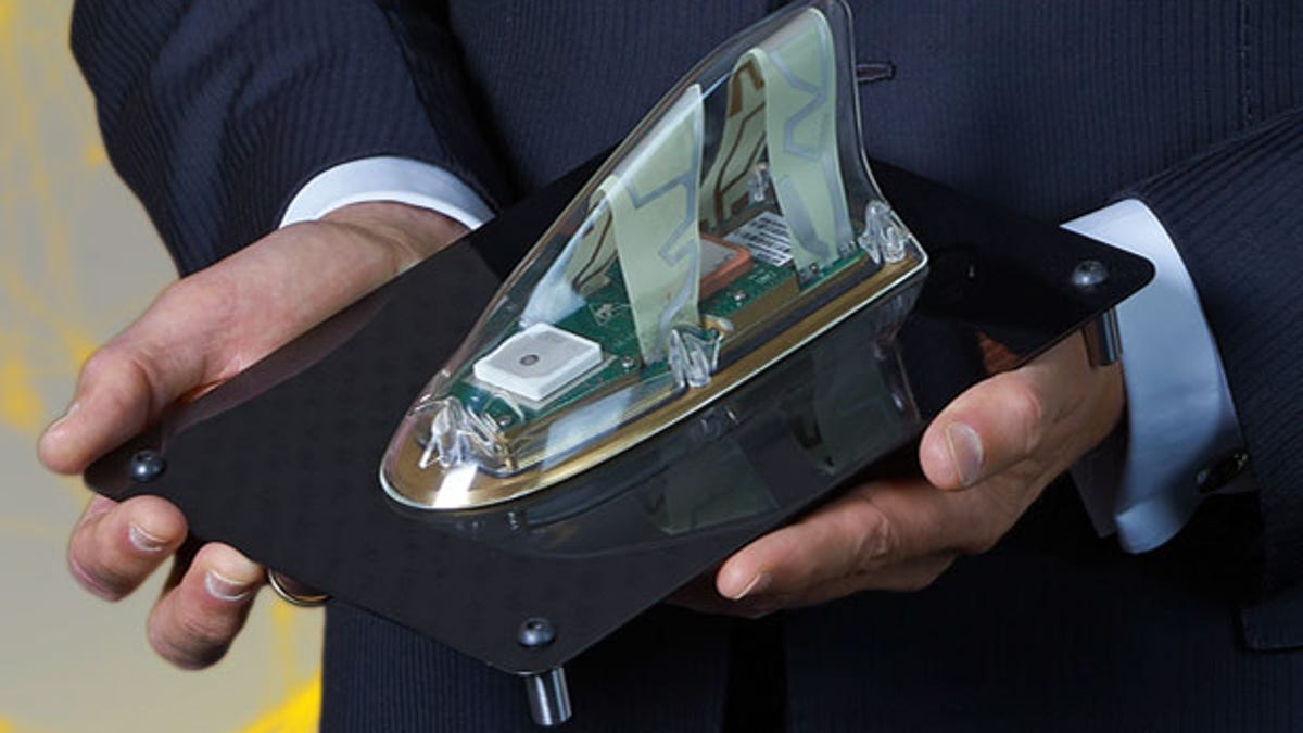 A Continental car antenna including integrated electronics for mobile network data transfer.