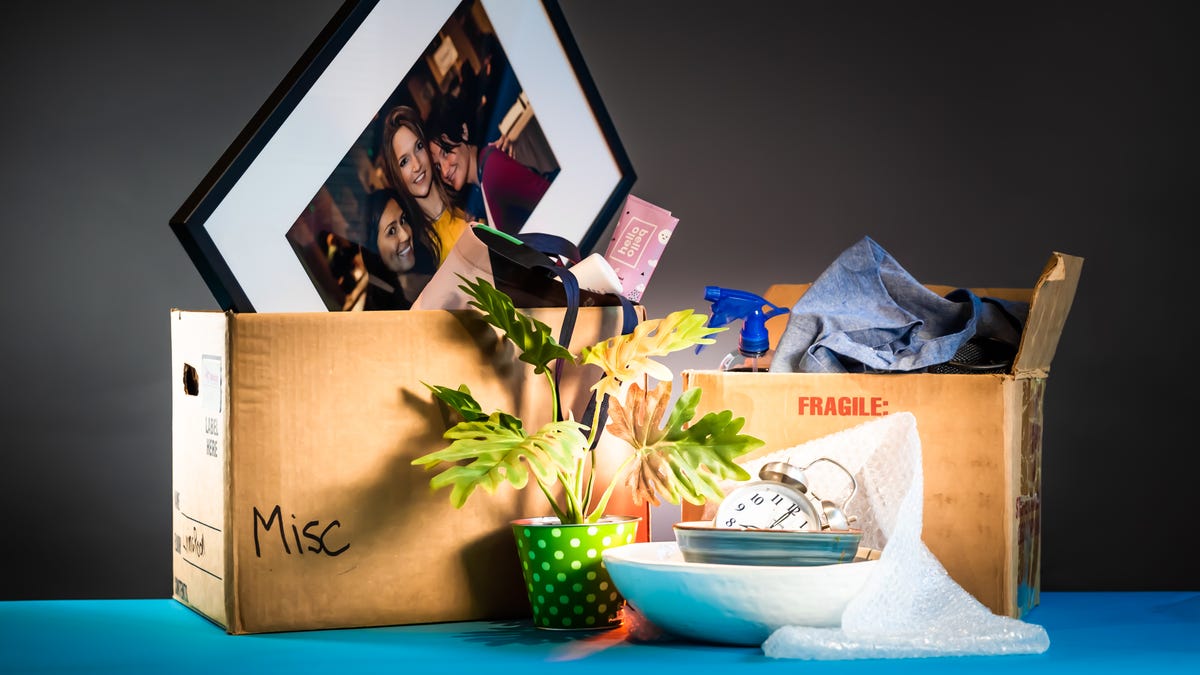 Items in moving boxes and on table