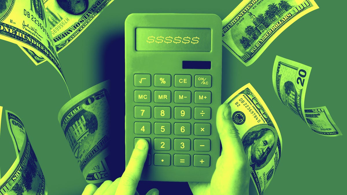 green calculator with money falling on a green gradient background.