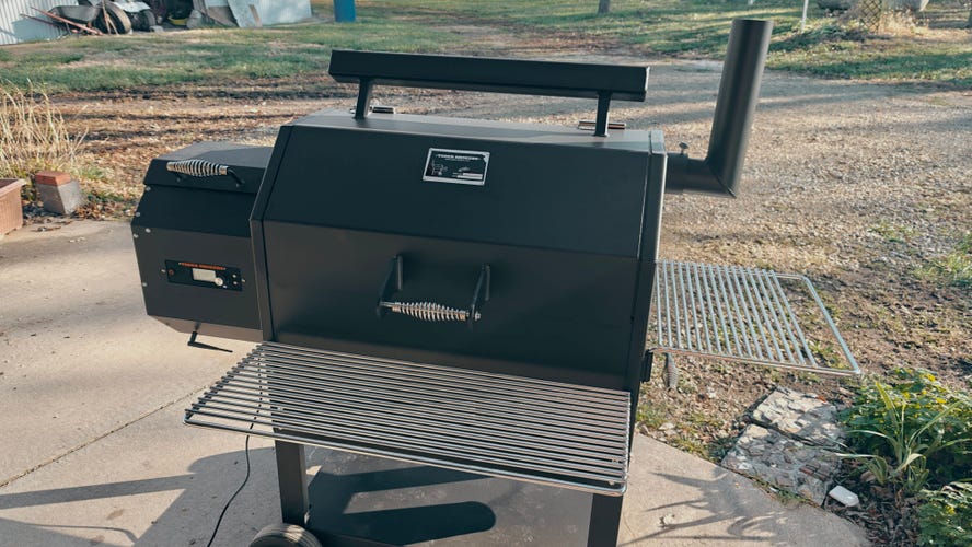 Yoder Smokers YS640s on a concrete patio