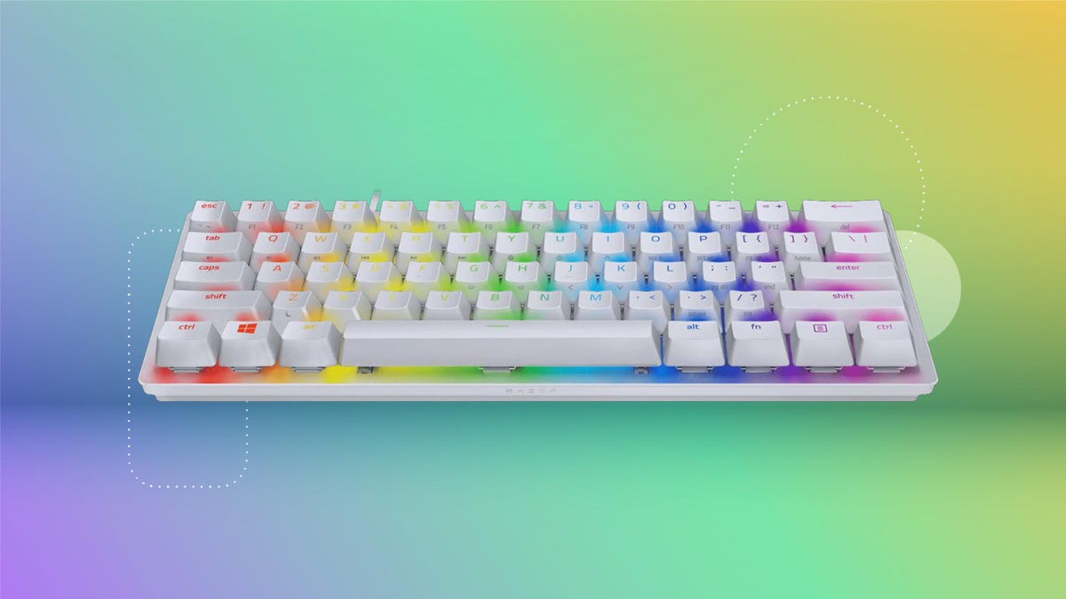 Razer Huntsman keyboard on rainbow CNET background