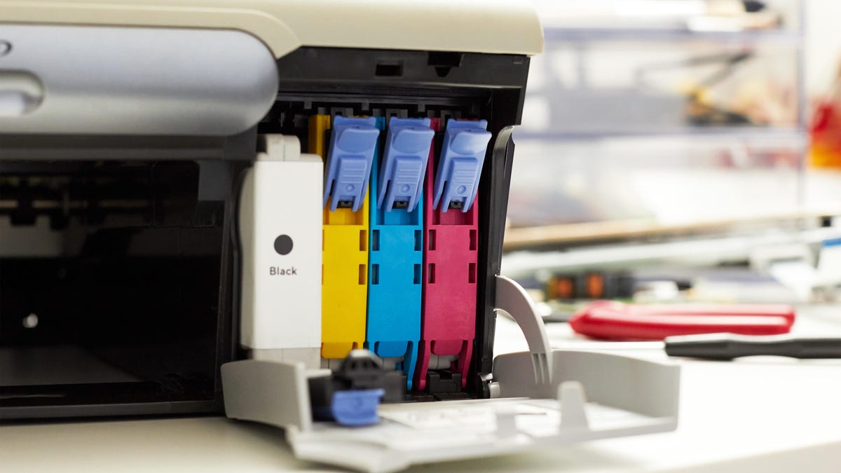 colored ink cartridges in a printer, yellow, blue, pink