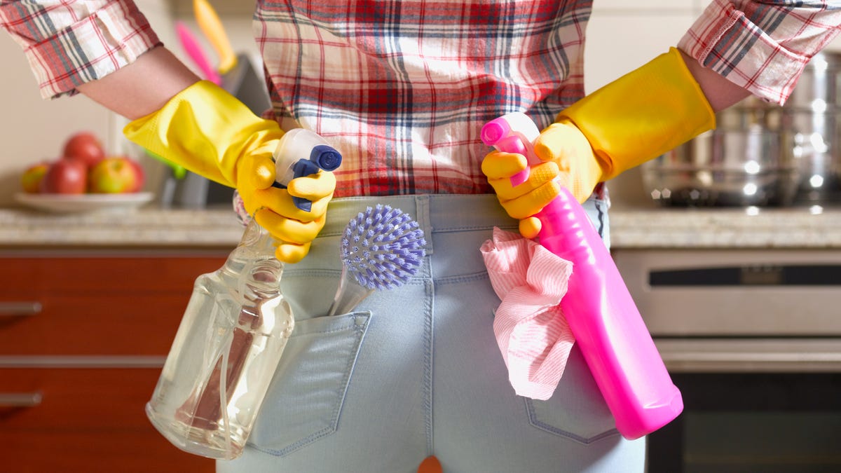 Girl preparing to spring clean kitchen
