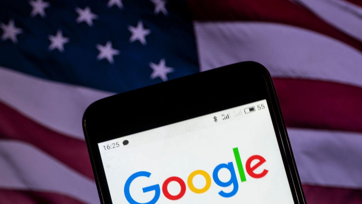 The Google logo seen displayed on a smart phone with a