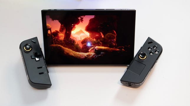 Lenovo gaming handheld display with controllers detached on either side