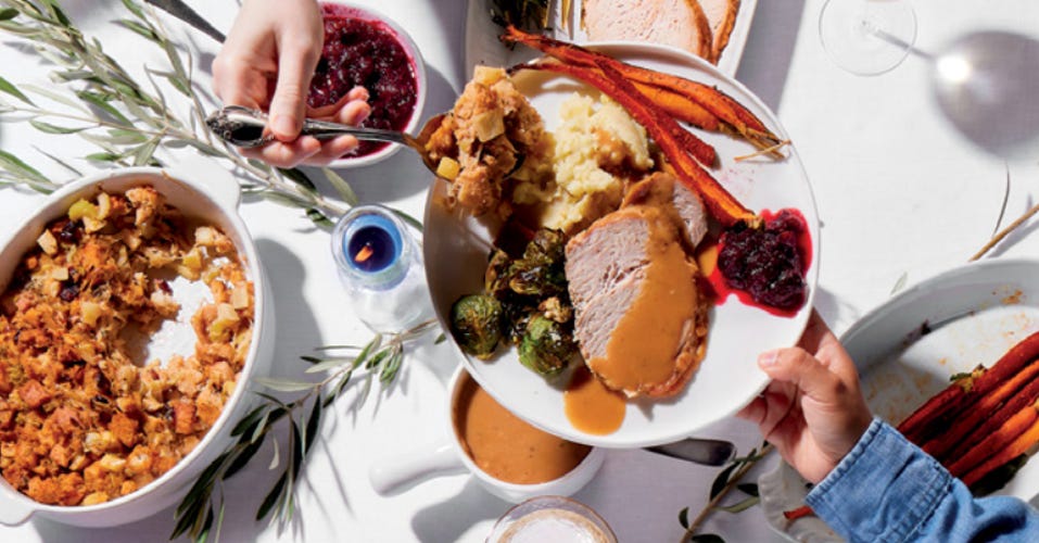 a thanksgiving dinner on a white table