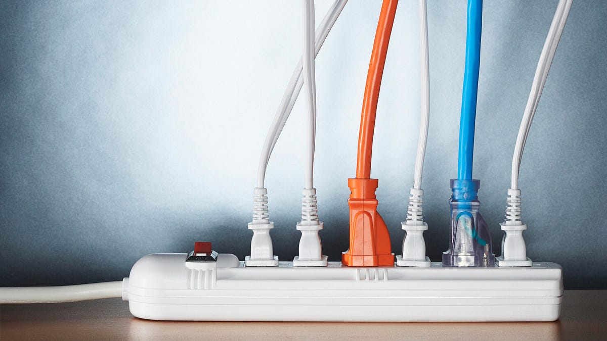 Cords plugged into a power strip.