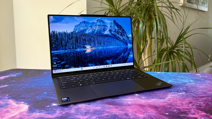 Lenovo ThinkPad X9 14 Aura Edition laptop at an angle next to a house plant