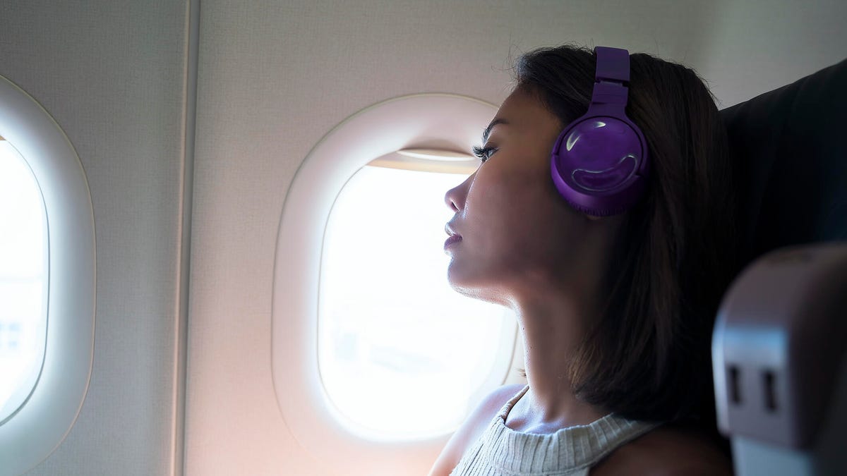 Woman travels in airplane