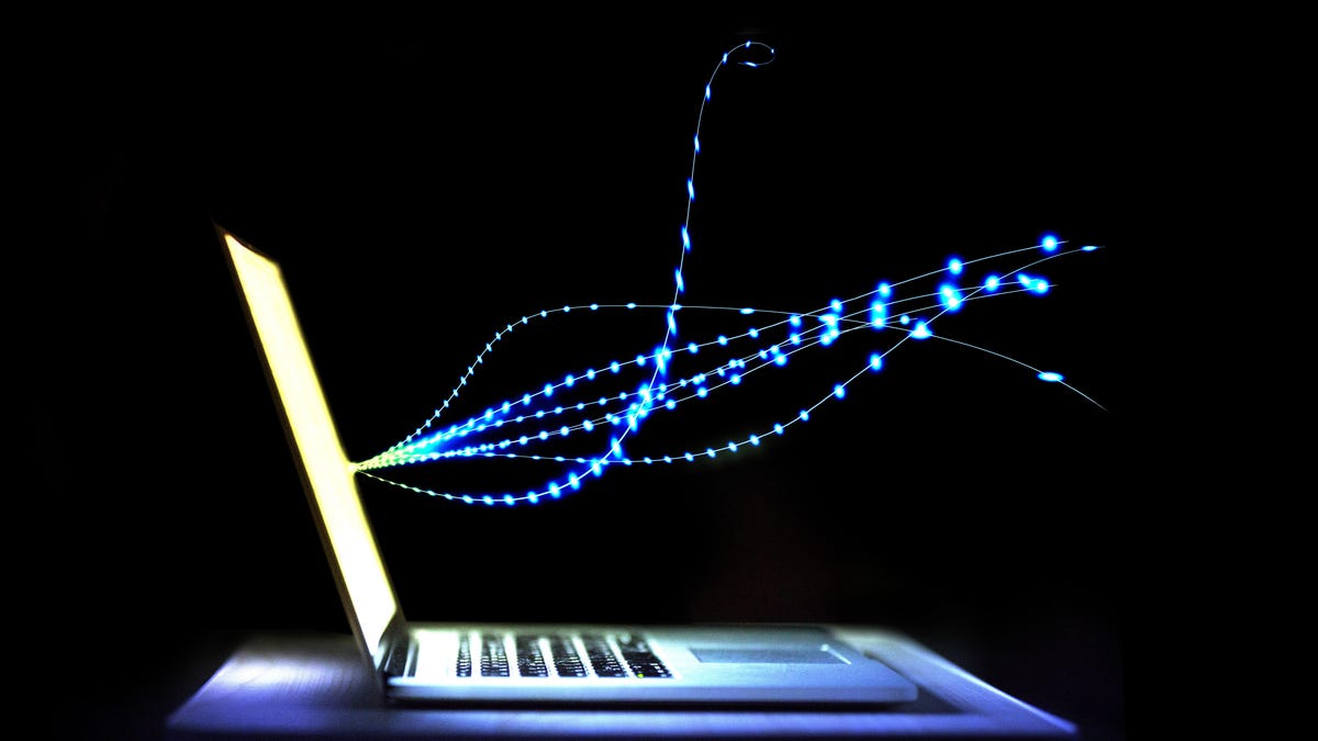 graphic of a spiral of light streaming out of a laptop, against a dark background