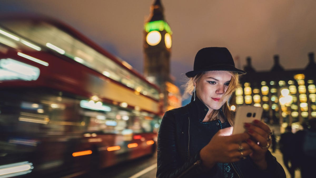 Woman using a phone in London