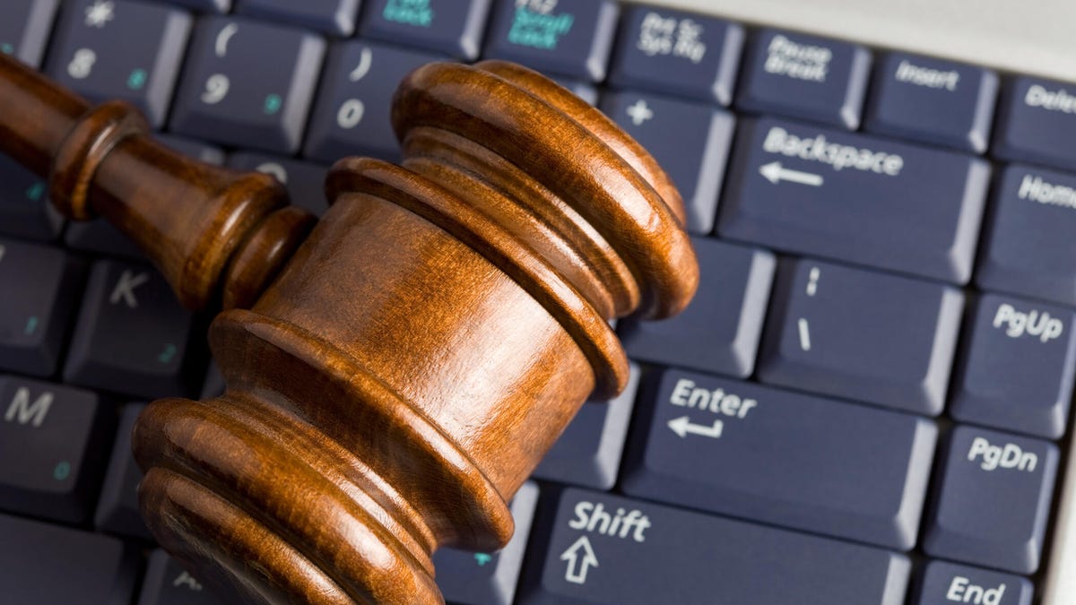 A court gavel on a computer keyboard