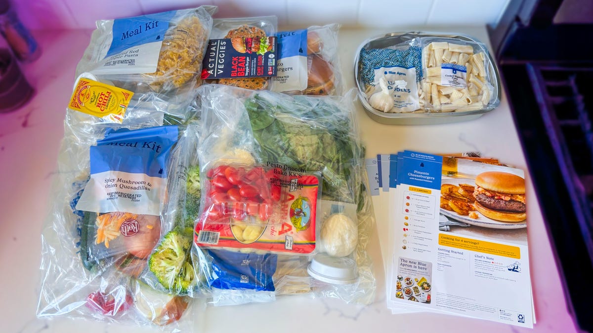 All the ingredients from my Blue Apron meal kits laid out on a white counter.