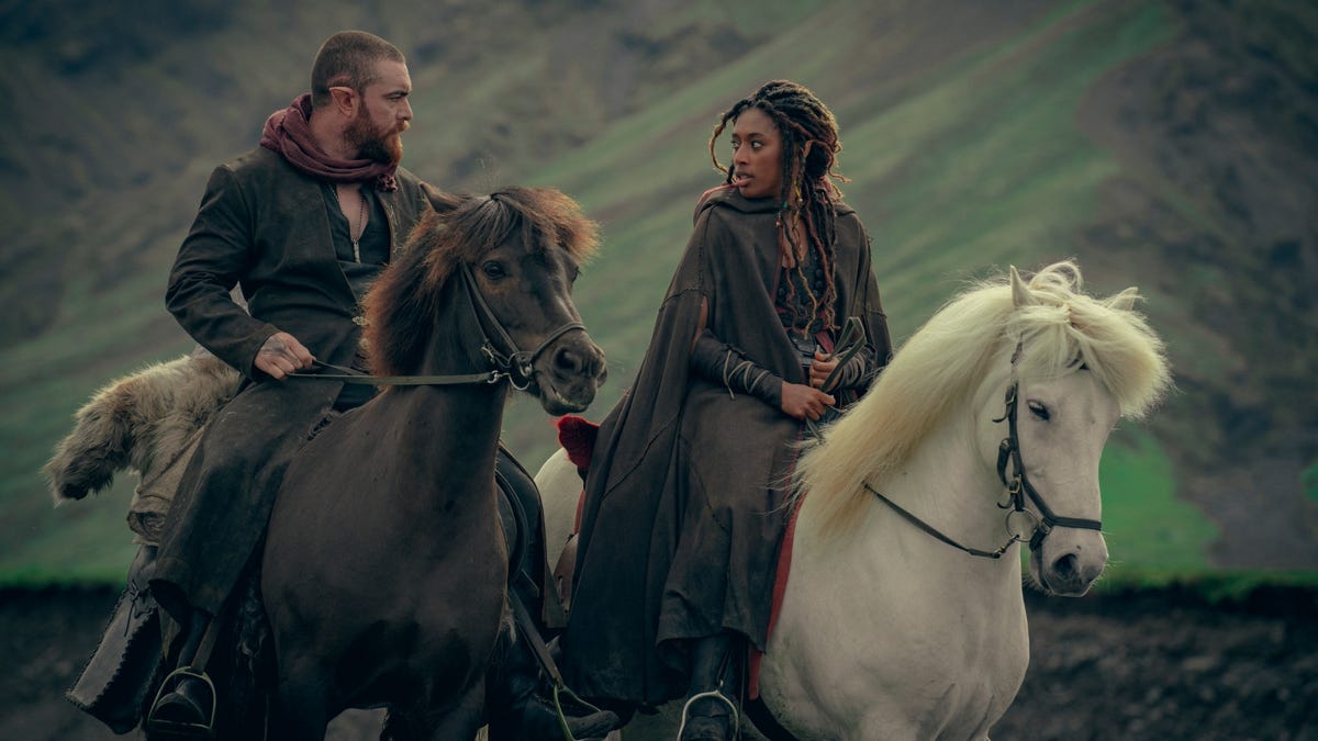 elf man and elf woman ride horses side by side in witcher blood origins