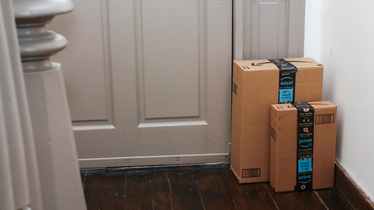 Two Amazon packages sitting by a door