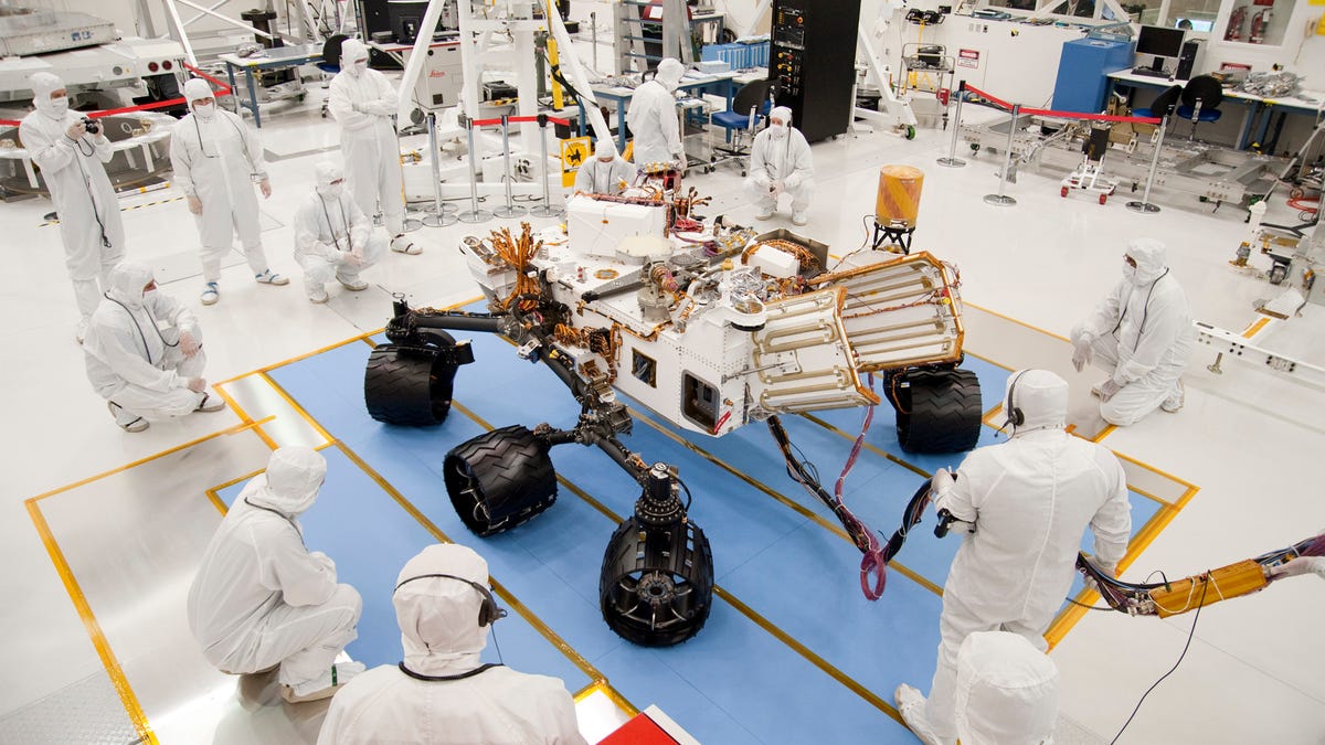 NASA's next Mars rover, Curiosity, takes its first, brief test drive in a Jet Propulsion Lab clean room on July 23.
