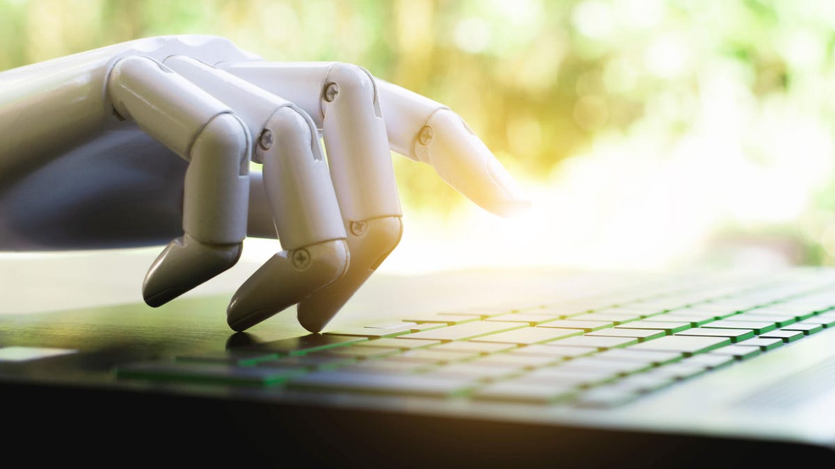 An image of a robot hand typing on a keyboard gettyimages-1065011316