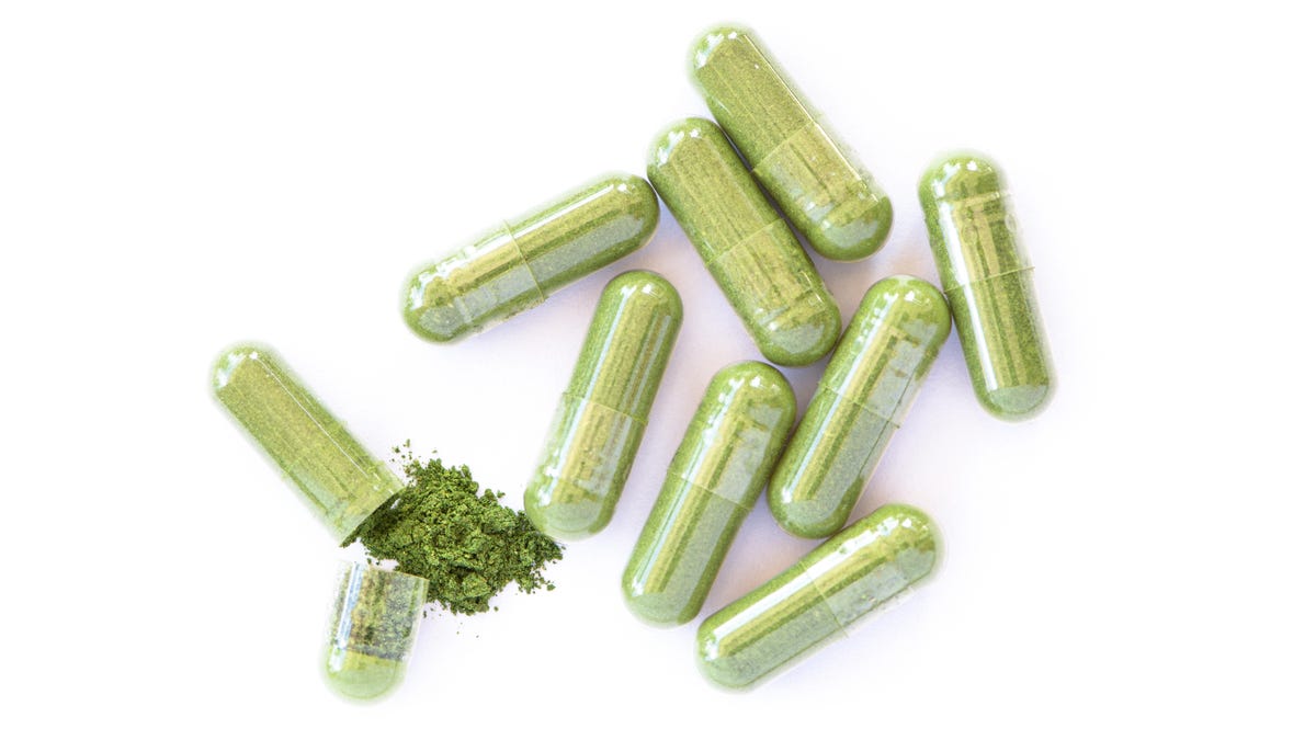 Clear capsules with green powder