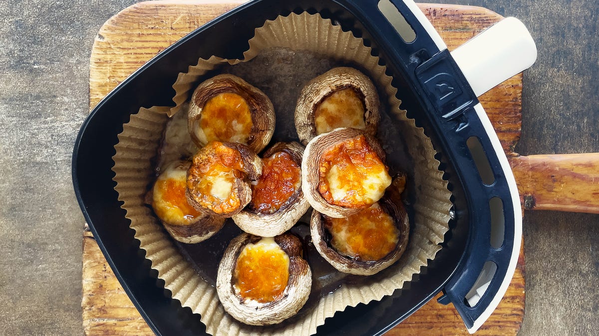 Stuffed mushrooms in an air fryer basket