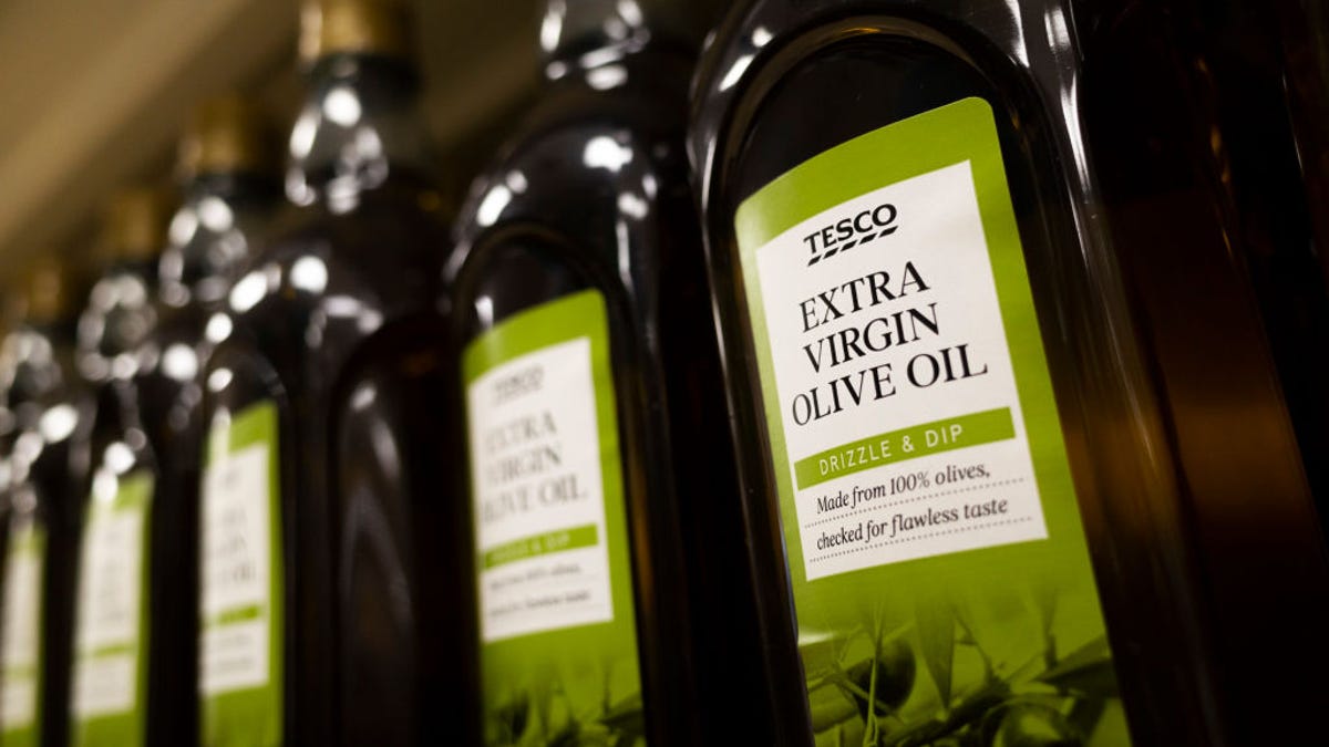 Bottles of olive oil on a supermarket shelves