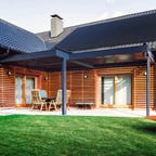 Solar panels on a wooden house.