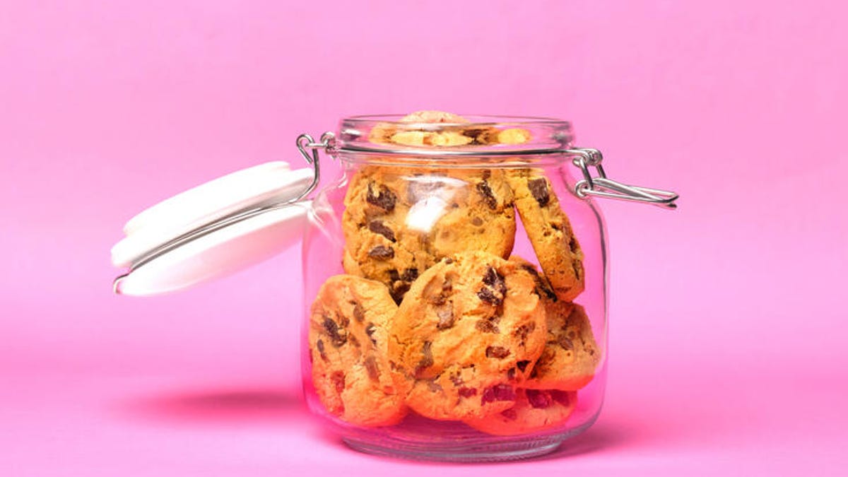 Cookies in a jar on a pink background