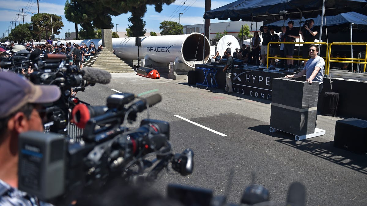 Elon Musk speaking outside the Hyperloop test tunnel in 2018.