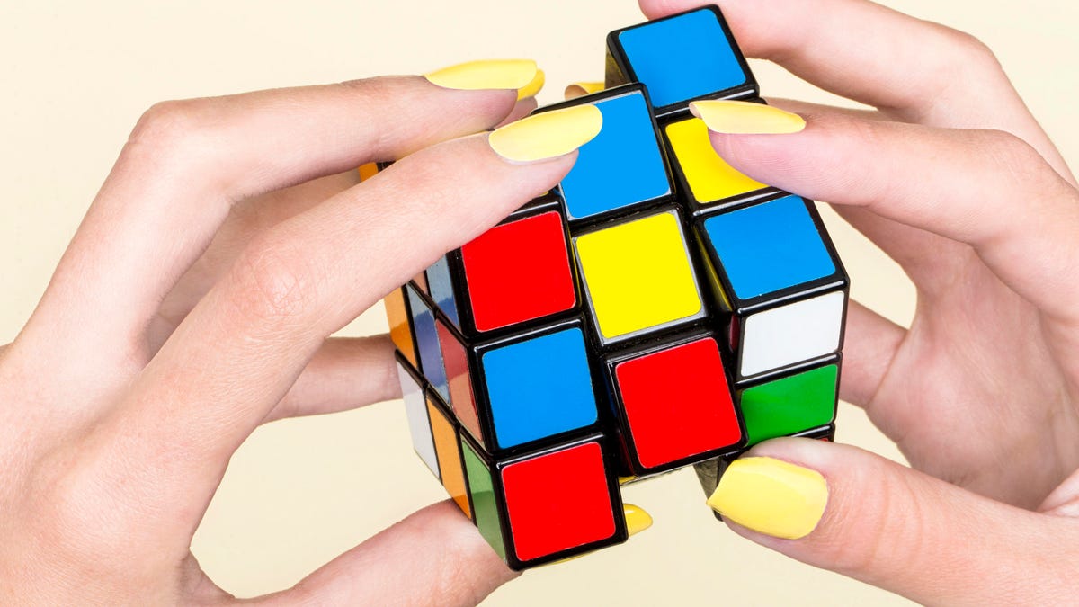 Close-up of woman's hand with Rubik's Cube