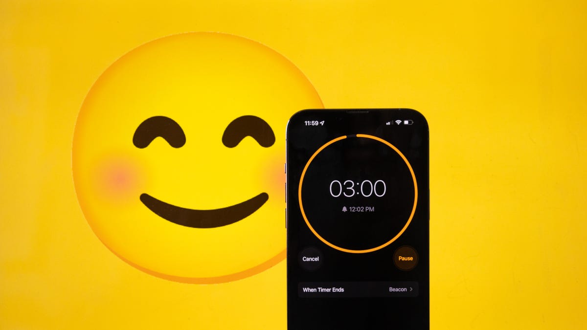 Smiley face and a phone with a timer set for 3 minutes on a yellow background