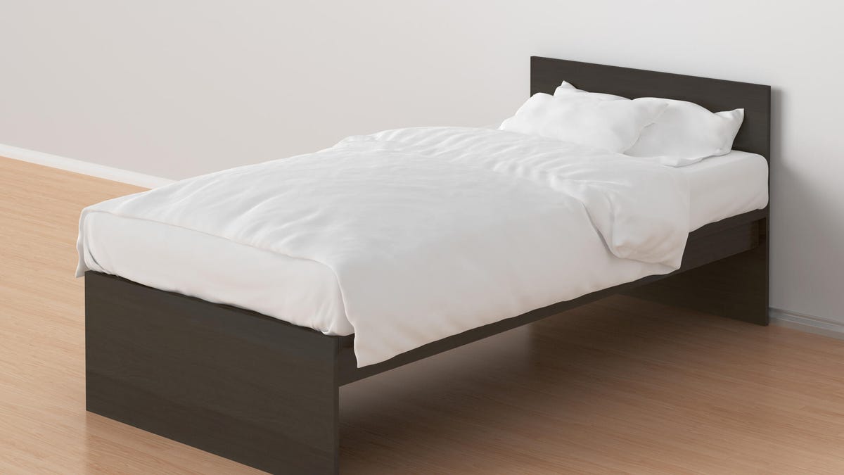 Twin Size Single Bed in a plain room