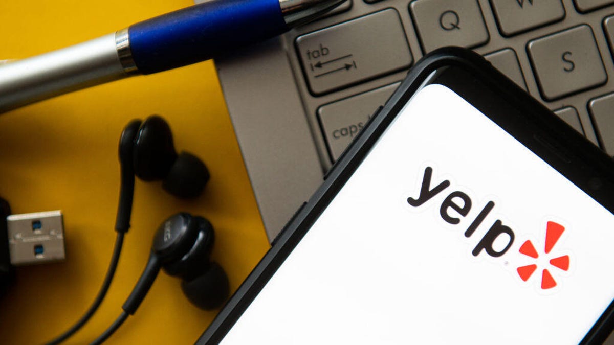 Phone with Yelp logo