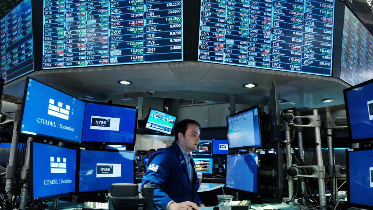 A broker on the floor of the New York Stock Exchange