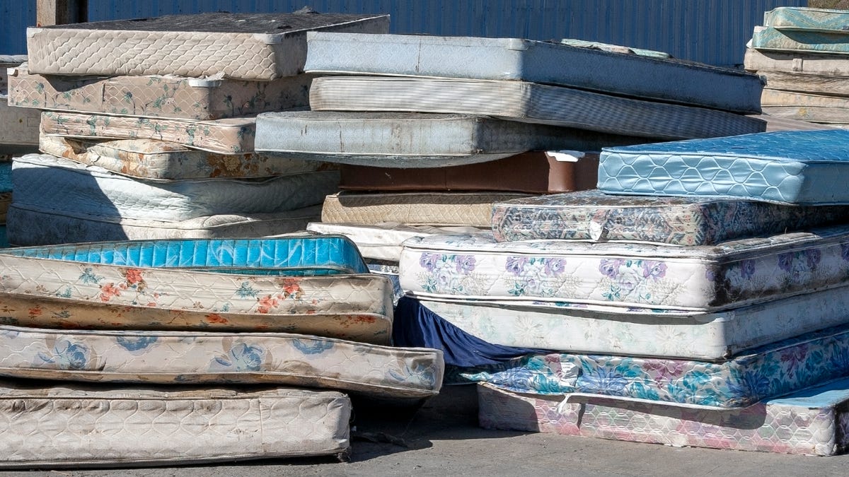 Mattresses stacked at a landfill