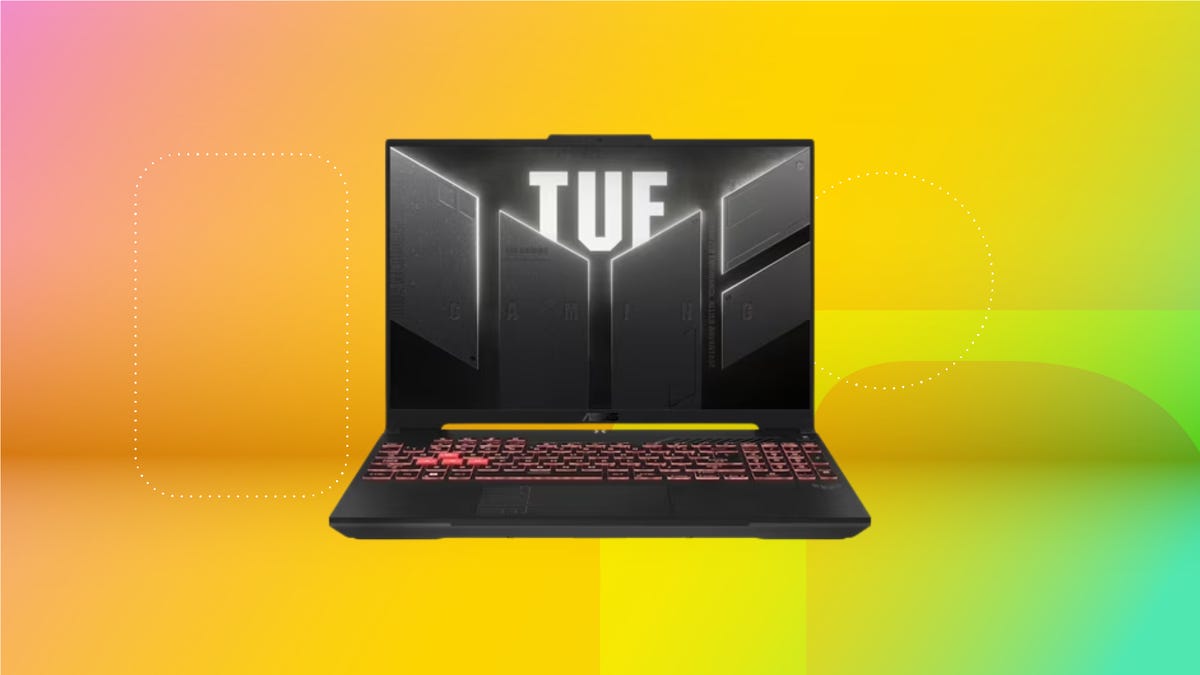 The Asus TUF A16 gaming laptop is displayed on a gradient orange background.