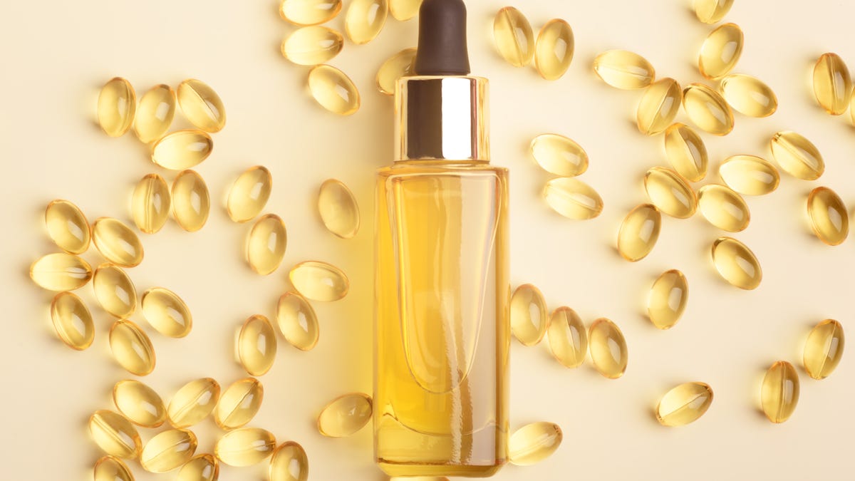 Bottle of vitamin E oil and vitamin E supplements