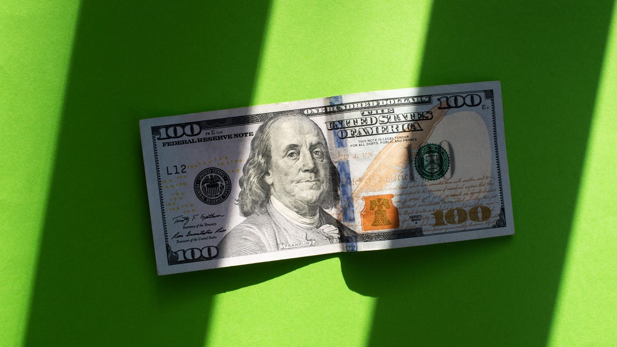 $100 bill on a green background