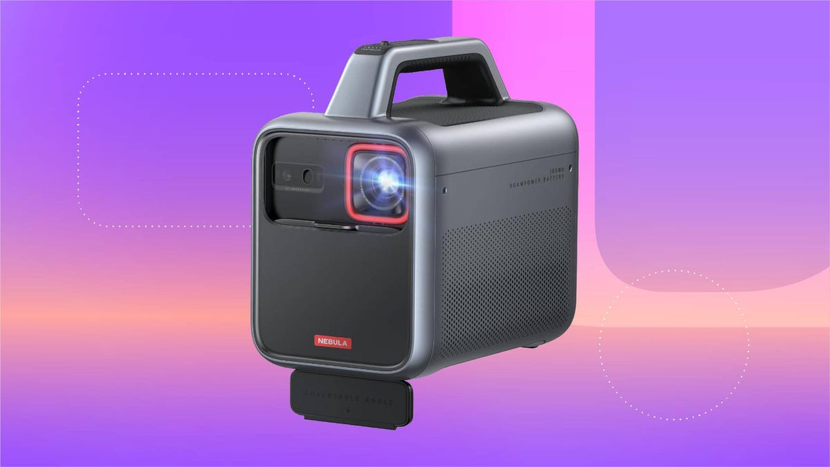A gray and red projector against a purple gradient CNET background.