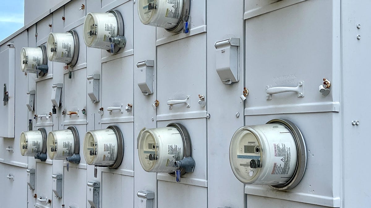 Electric meters on the side of a building.