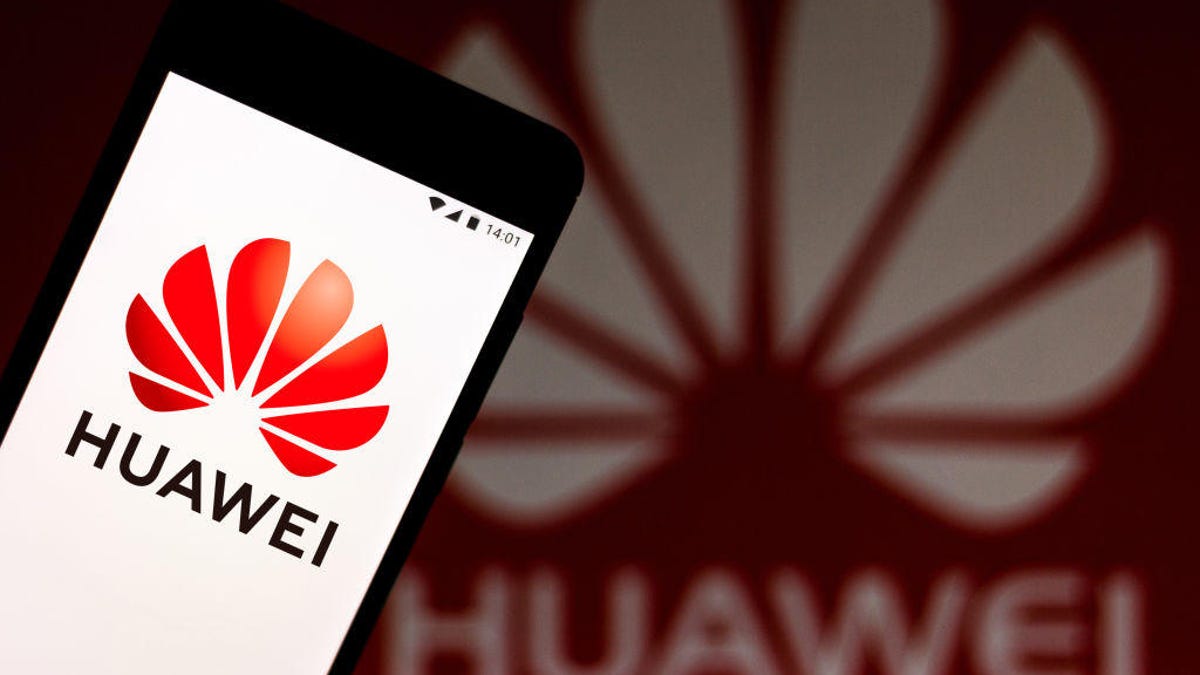In this photo illustration a Huawei logo seen displayed on a